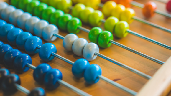 Picture of rainbow-beaded abacus.